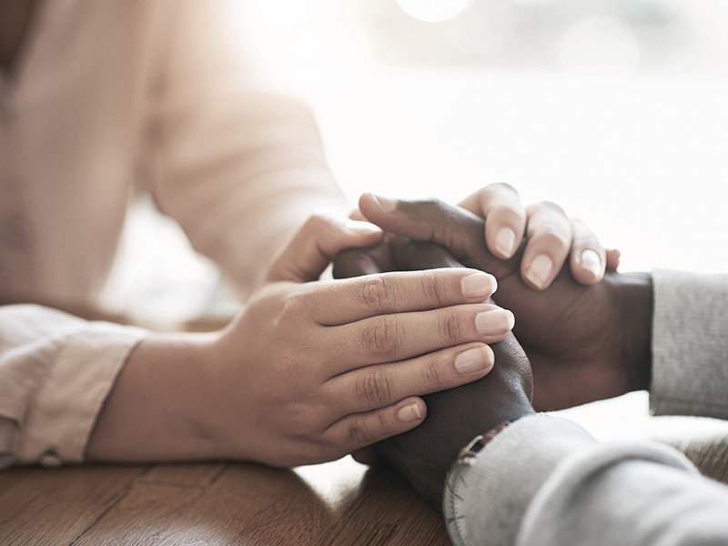 2 people with caring hands
